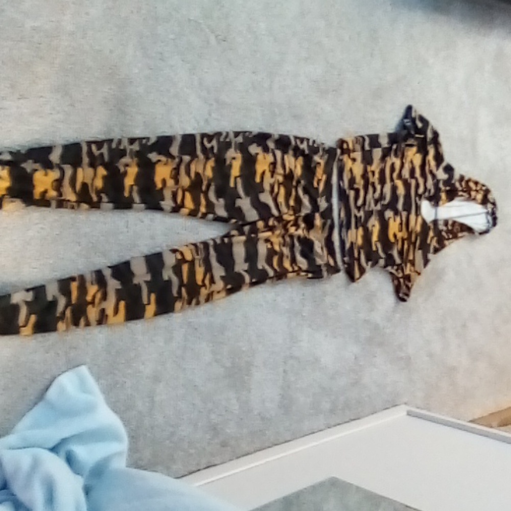 Size medium, brand is feathers it's polyester and spandex